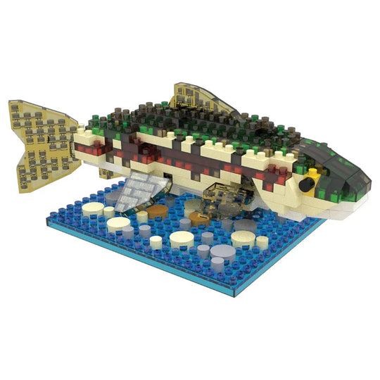 Fish-shaped building block set on a blue baseplate with a white background