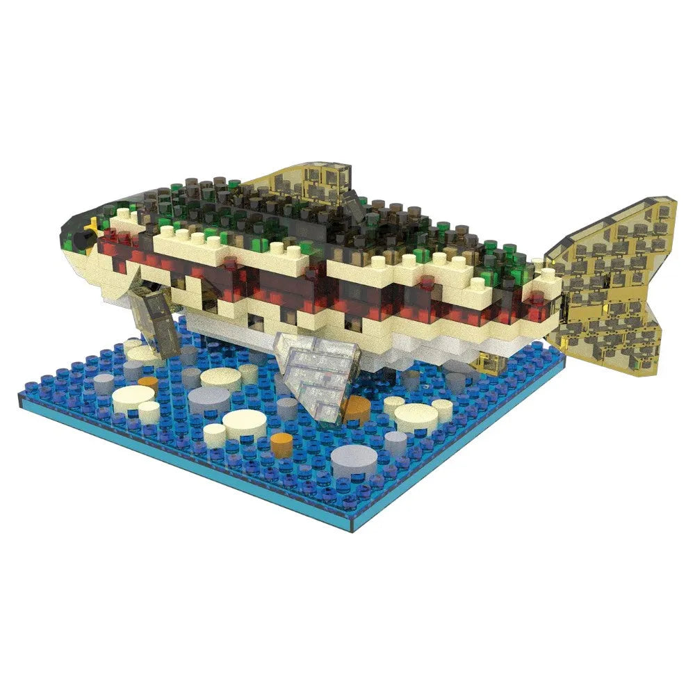 Fish-shaped building block set on a blue base with a white background