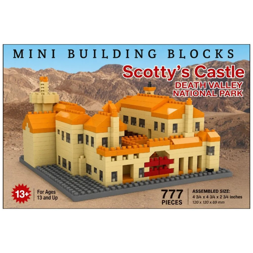 Mini Building Blocks set for Scotty's Castle in Death Valley National Park, featuring 777 pieces. The packaging shows a model of the castle built from beige and orange bricks on a gray base, set against a desert landscape background.