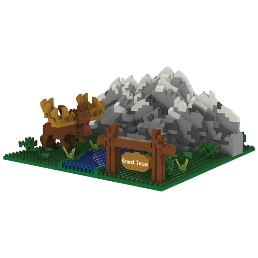 LEGO-style model of a mountain landscape with a sign reading &