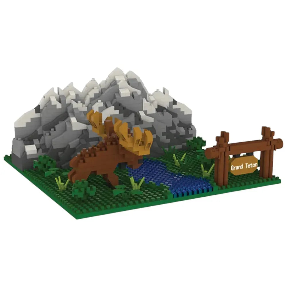 LEGO-like model of a moose in front of mountains with a sign reading &