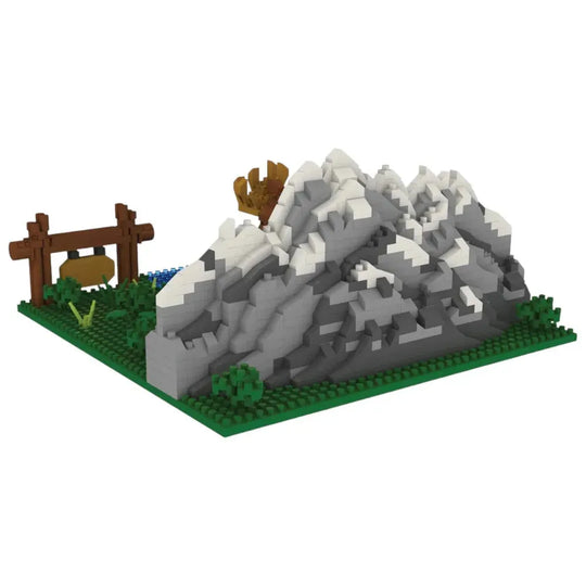 Interlocking brick set of a mountain with a wooden structure on a white background