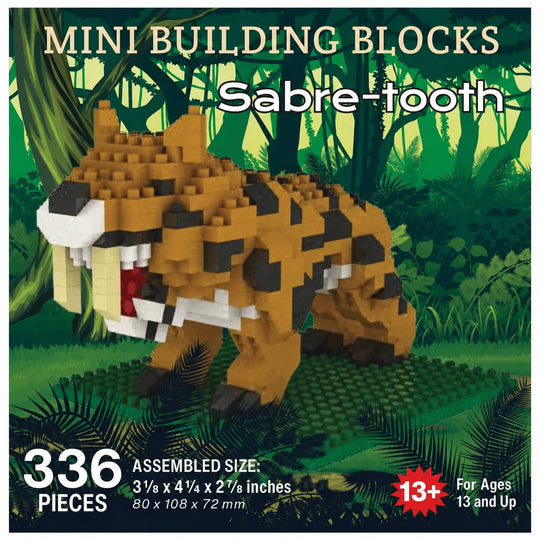 Box-style product graphic for a mini building blocks set featuring a saber-tooth tiger made from tan, black, white, and red blocks, with jungle artwork in the background and text showing 336 pieces and assembled size 3 1/2 x 4 1/2 x 2 7/8 inches.
