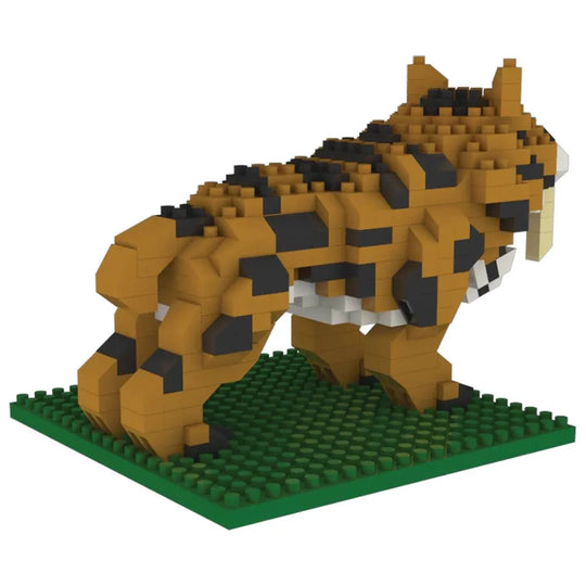 Toy tiger made of interlocking bricks on a green baseplate with a white background