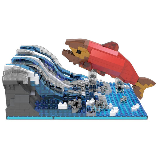 Toy building set with a red fish and wave structure on a white background