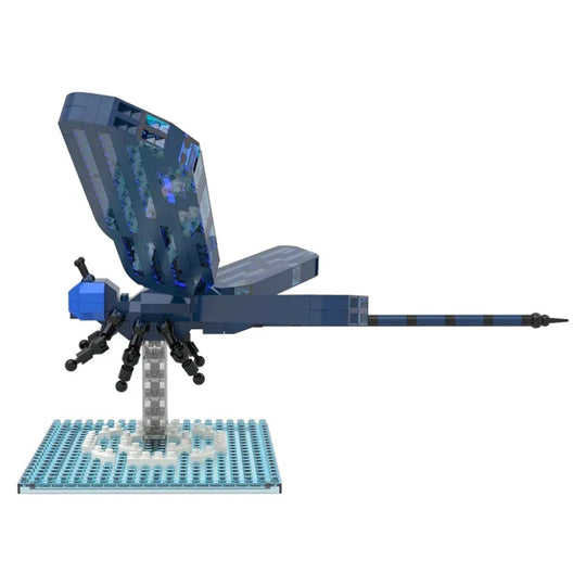 Toy model of a blue dragonfly on a white background