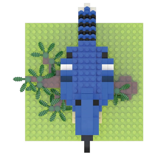 Blue bird-like figure made of interlocking bricks on a green baseplate with a polka dot pattern.