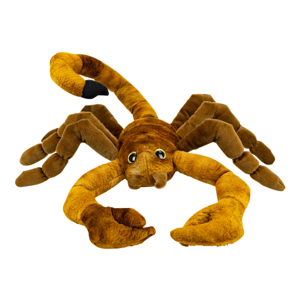 A plush scorpion toy in warm brown and golden-brown tones with large black-and-white eyes, photographed on a plain white background.