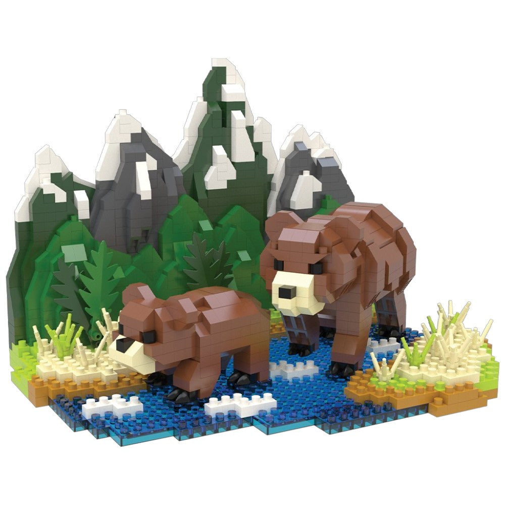 Toy bear figures with a mountain and forest background made from interlocking bricks.