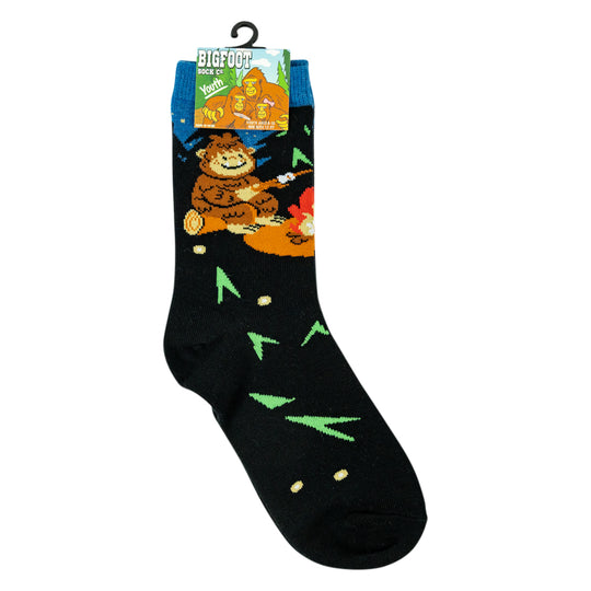 black crew sock with a Bigfoot graphic and pattern, hanging from a black plastic hanger against a plain white background.