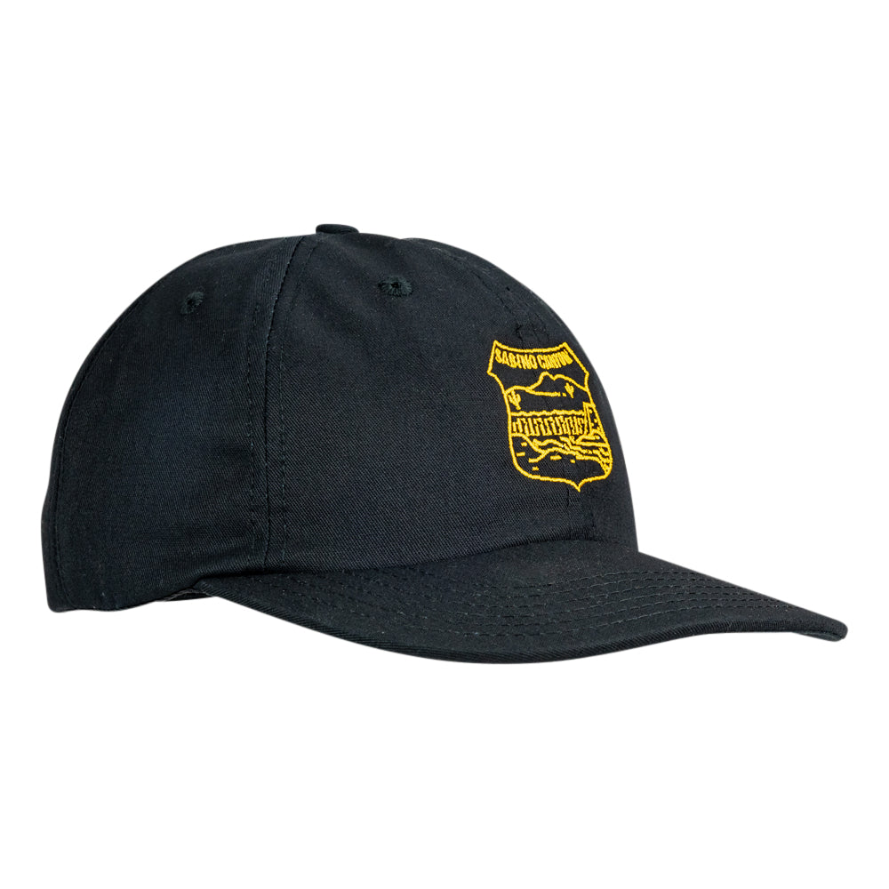 A black baseball cap with a yellow embroidered shield logo on the front, displayed against a solid white background.