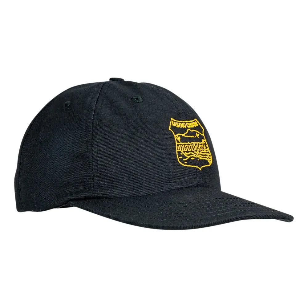 A black baseball cap with a yellow embroidered shield logo on the front, displayed against a solid white background.