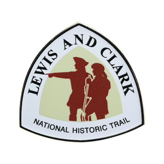 Metal lapel pin depicting the official trail marker sign for the Lewis &amp; Clark National Historic Trail on a white background.