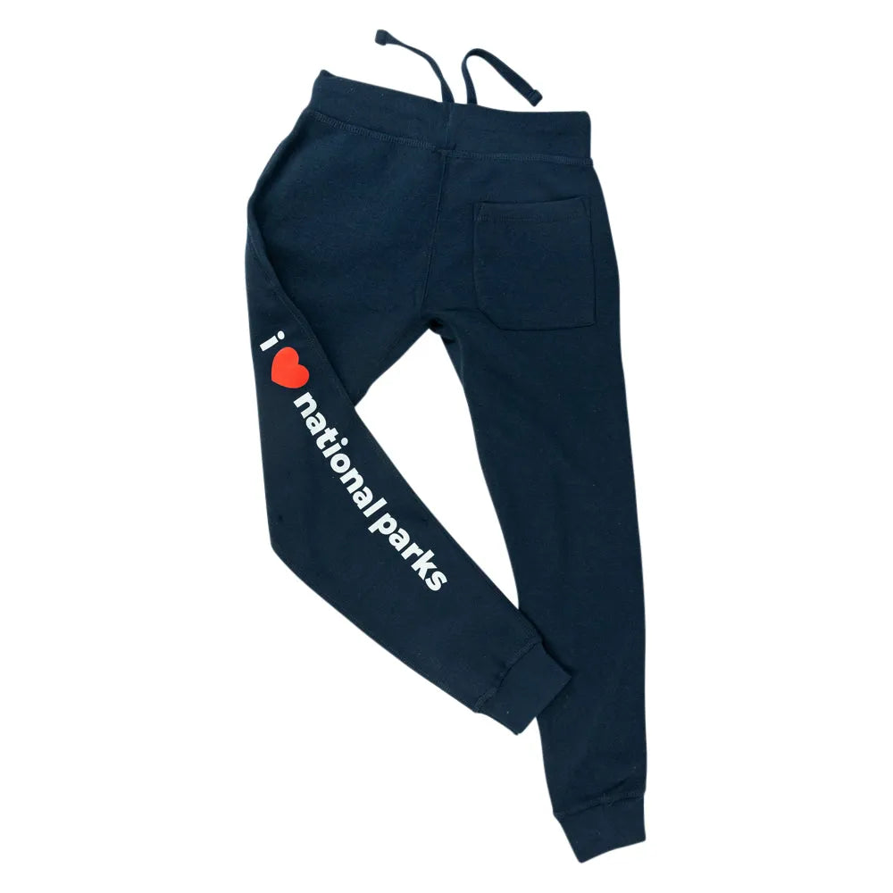 Dark navy blue sweatpants with a side graphic that reads &