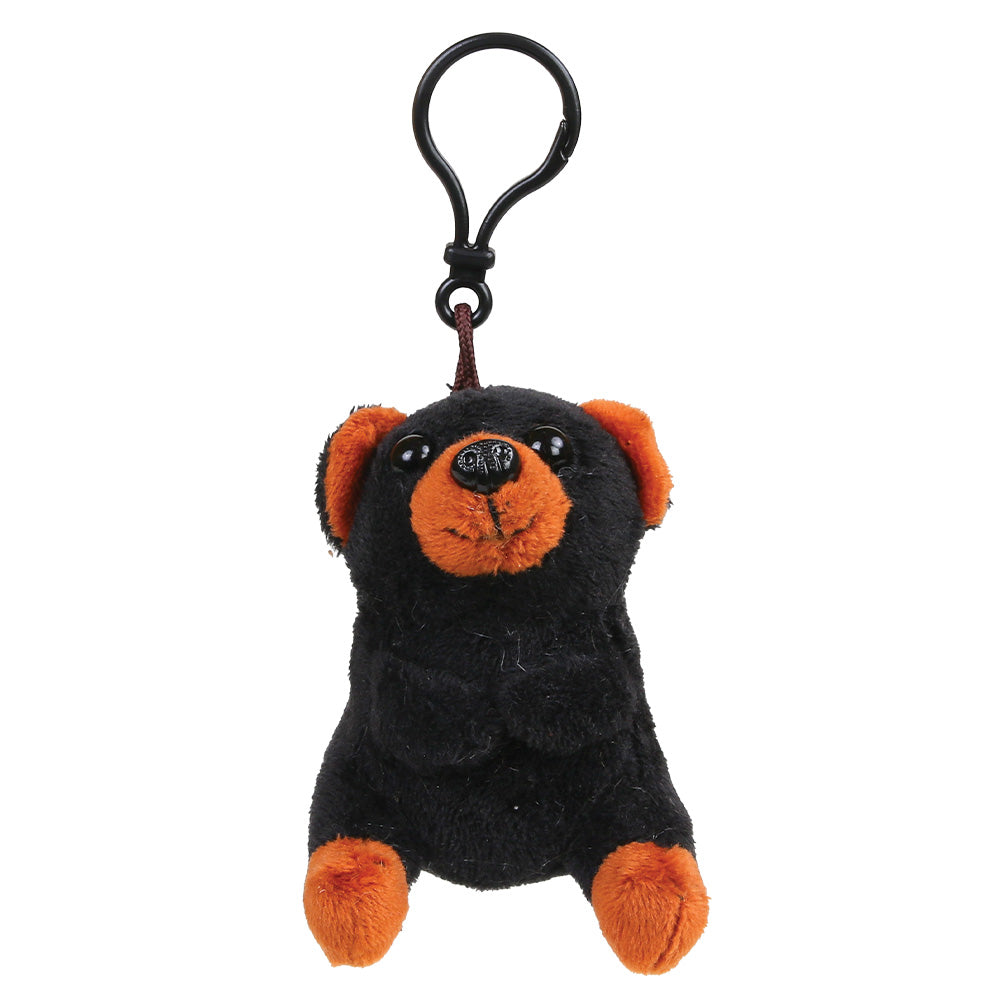 A small plush black bear keychain or bag charm in black and orange, attached to a black metal carabiner clip, shown on a plain white background.