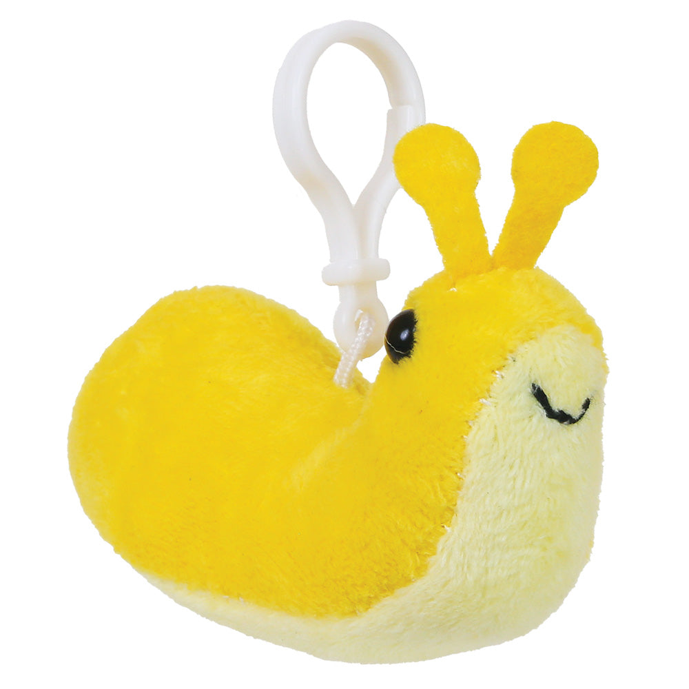 A yellow and cream plush snail keychain with a white plastic clip, featuring embroidered black eyes and a smile on a plain white background.