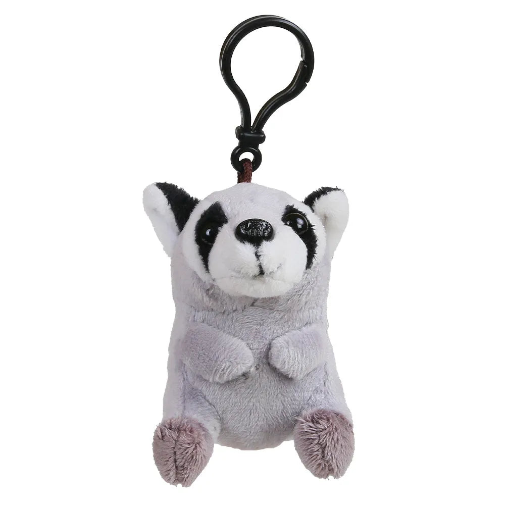 A small plush raccoon keychain with a black metal carabiner clip, featuring a white and gray body with black facial markings and pinkish-gray paws, shown on a plain white background.