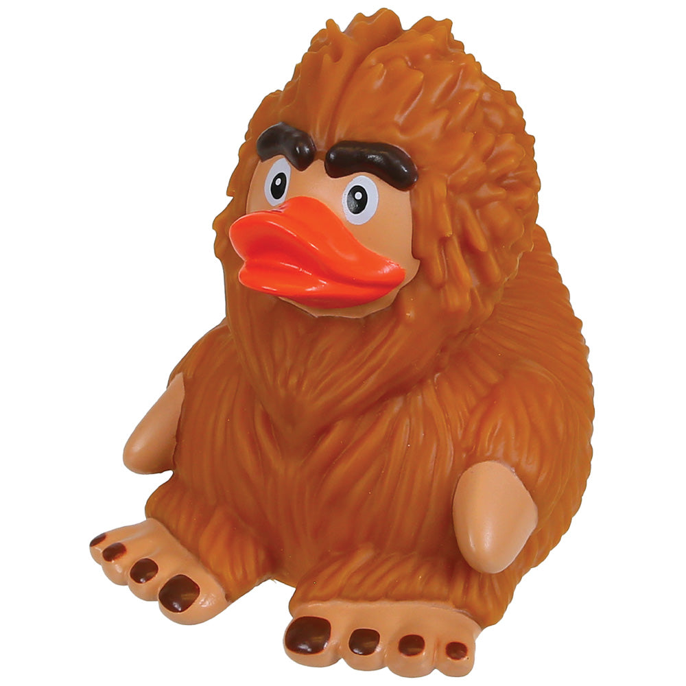 A novelty rubber toy of a brown furry creature with a duck-like orange beak, black eyebrows, and beige limbs, shown against a plain white background.