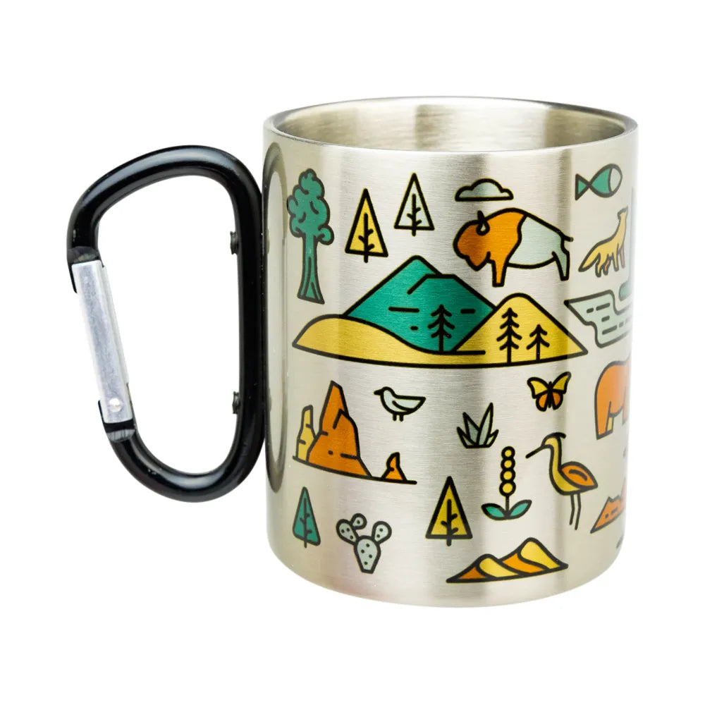 A stainless steel travel mug with a black carabiner handle, decorated with colorful outdoor-themed illustrations including a bison, mountains, trees, birds, and plants.