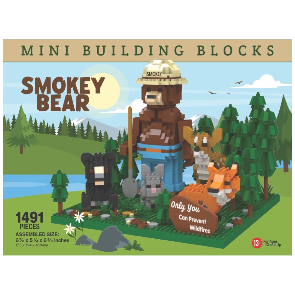 An image of the Smokey Bear and Friends building block set. It features Smokey Bear with his ranger flat hat and shovel, standing in a forest with a deer, bear, rabbit, fox, and his slogan "Only You Can Prevent Wildfires." 