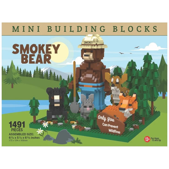 An image of the Smokey Bear and Friends building block set. It features Smokey Bear with his ranger flat hat and shovel, standing in a forest with a deer, bear, rabbit, fox, and his slogan "Only You Can Prevent Wildfires." 