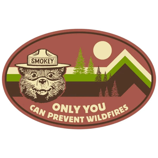Smokey Bear vintage-style sticker with mountain stripes, trees, and the message “Only You Can Prevent Wildfires.”