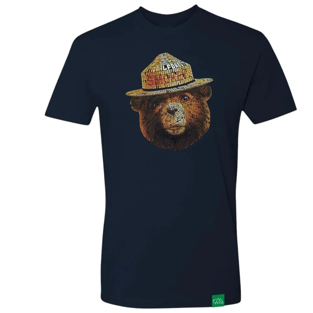 A navy blue short-sleeve t-shirt featuring a graphic of Smokey Bear wearing a flat cap, set against a plain white background