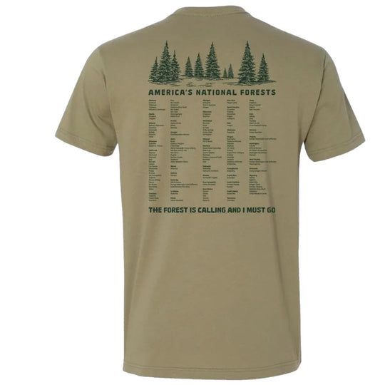 Back of tan America’s National Forests T-shirt with tree graphic, forest list, and “The Forest Is Calling And I Must Go” text.