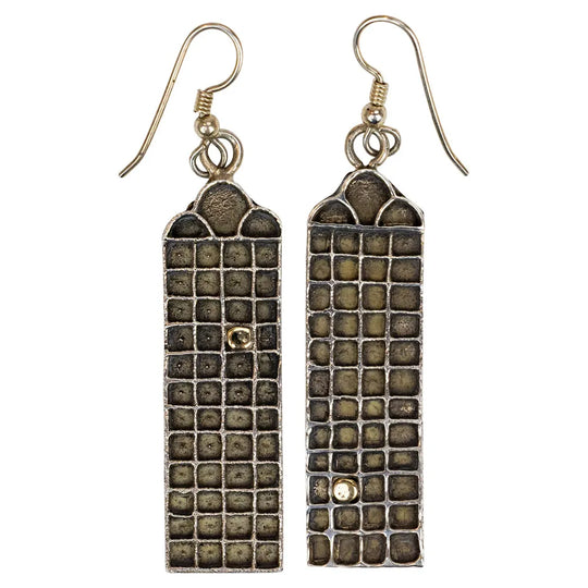Pair of rectangular earrings with textured design on a white background