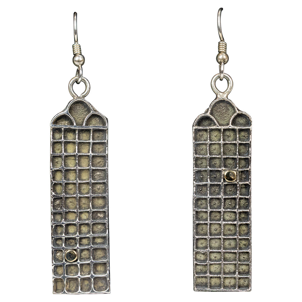 Pair of rectangular earrings with textured design on a white background
