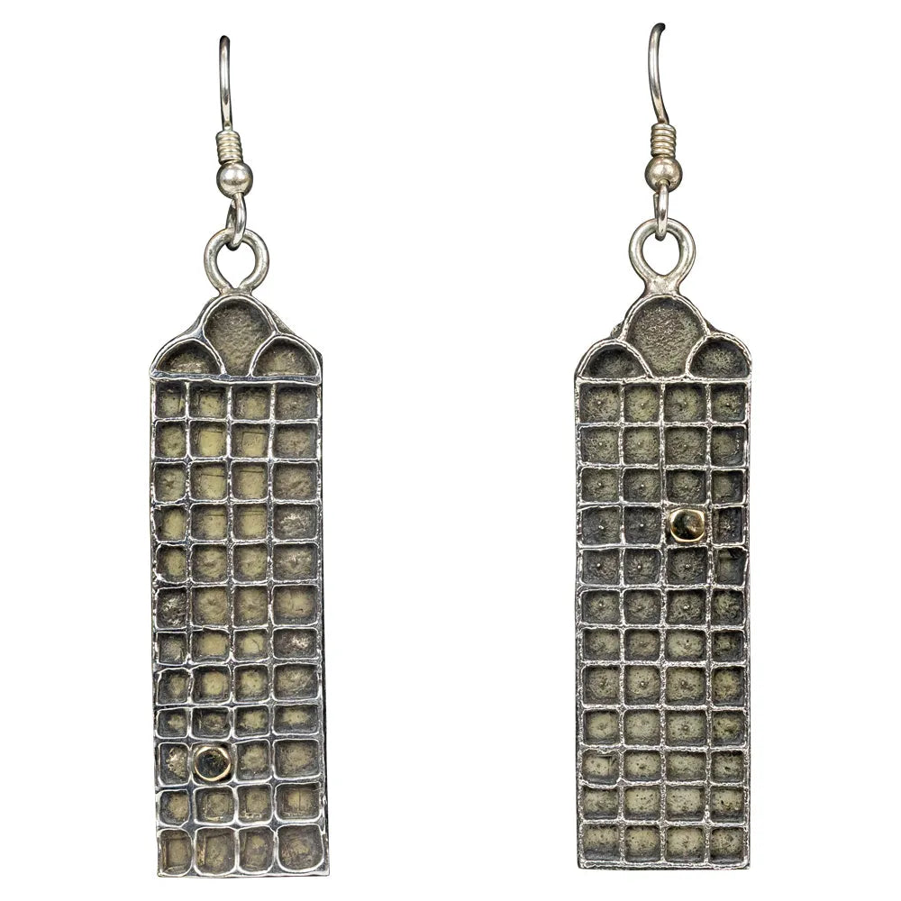 Pair of rectangular earrings with textured design on a white background