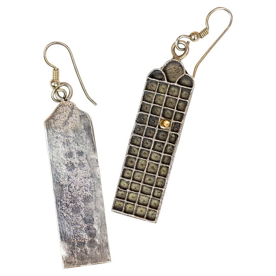 Pair of rectangular earrings with textured design on a white background