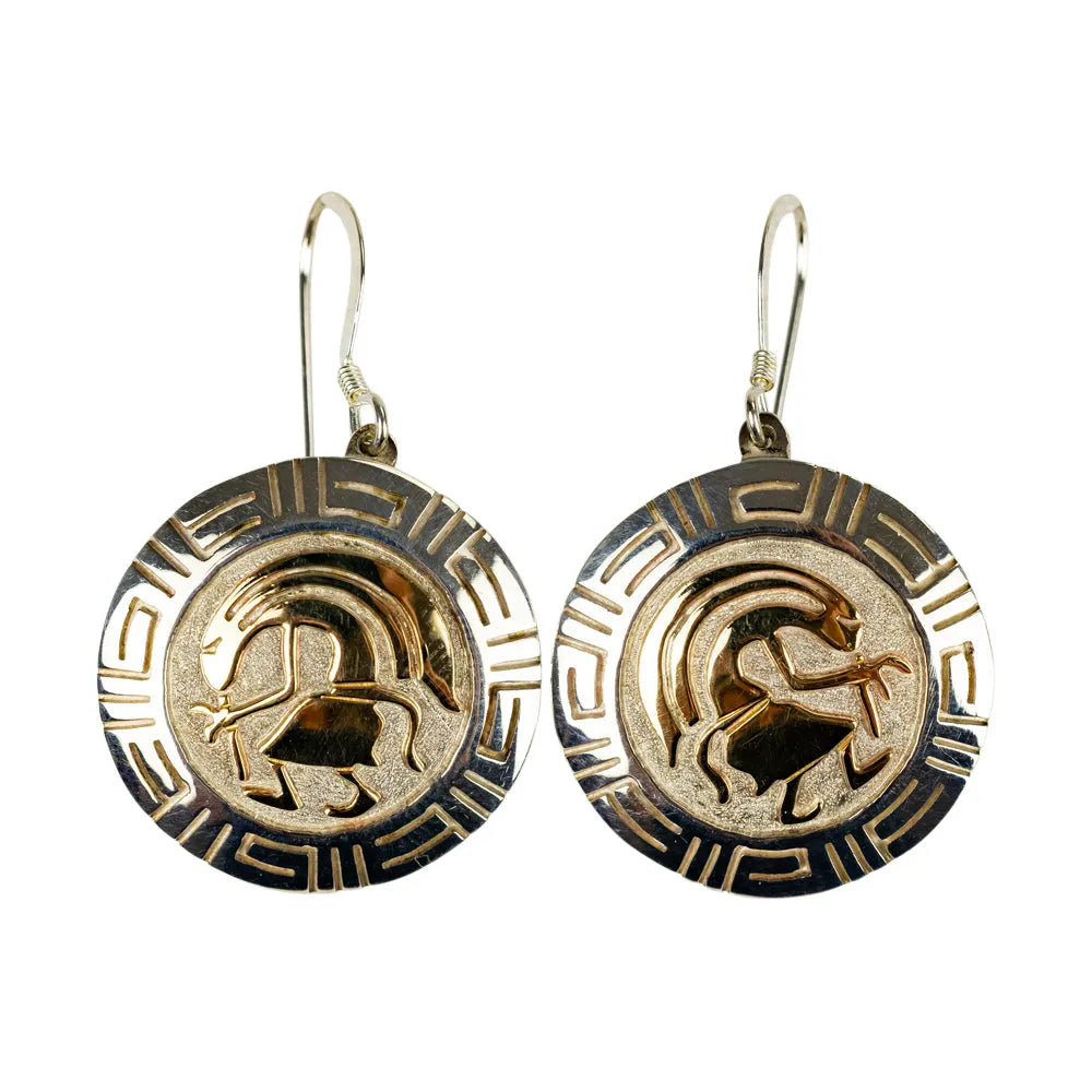 Pair of gold and silver Navajo earrings with an overlay design on a white background