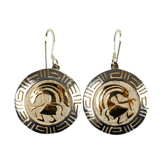Pair of gold and silver Navajo earrings with an overlay design on a white background
