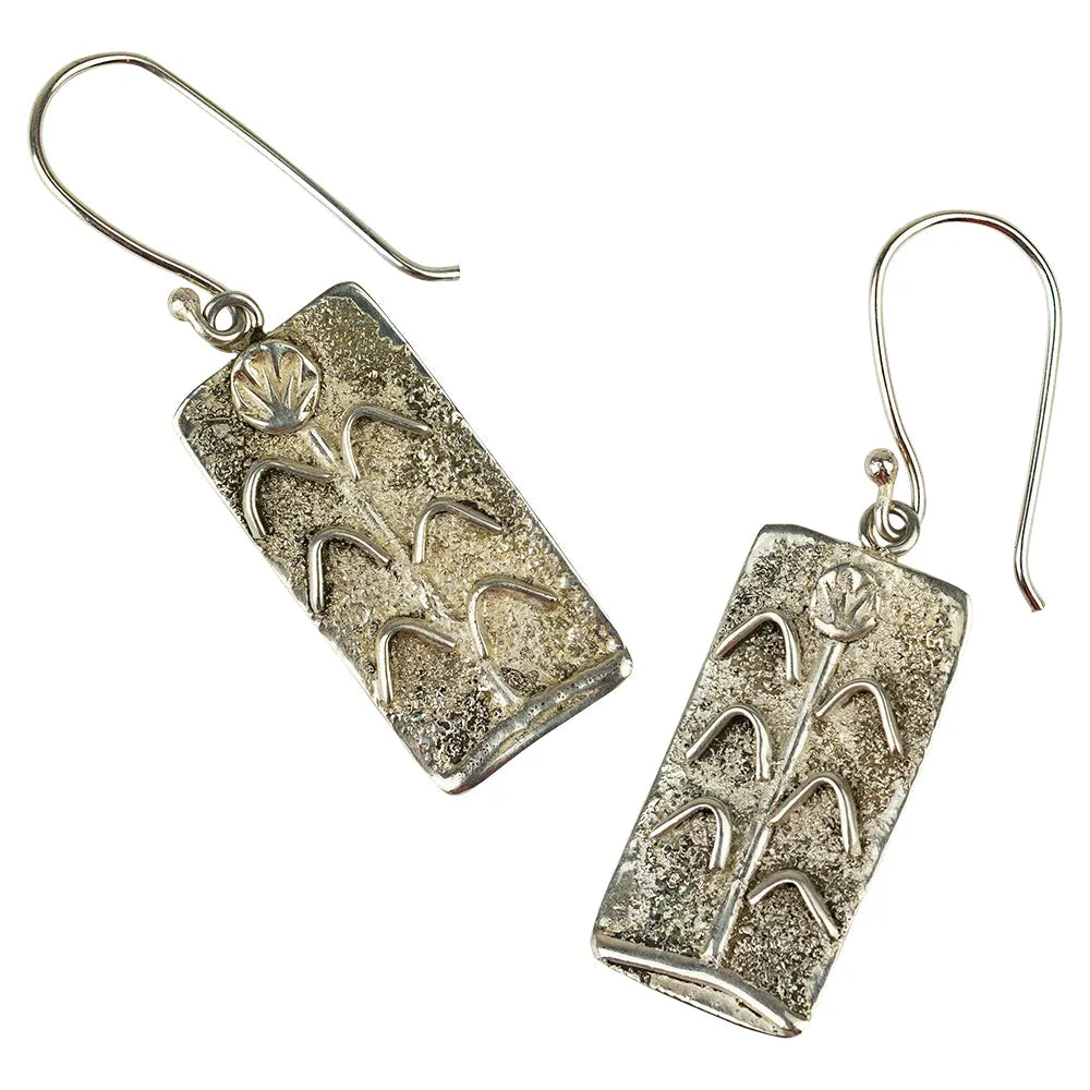 Sandcast Sterling silver dangle earrings on a white background