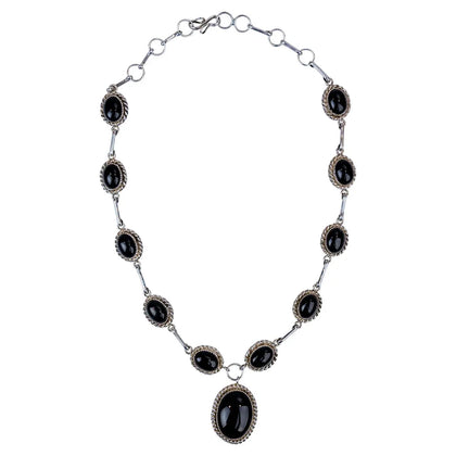 Sterling silver necklace with onyx on a white background