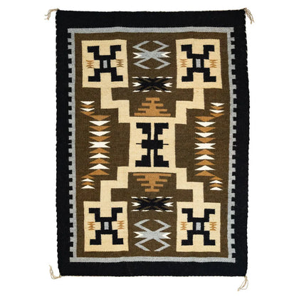 Woven rug with geometric pattern on a plain background