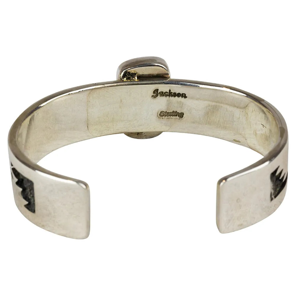 Silver bracelet with 'Jackson' hallmark engraving on a white background