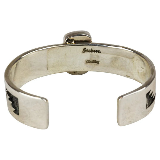 Silver bracelet with 'Jackson' hallmark engraving on a white background