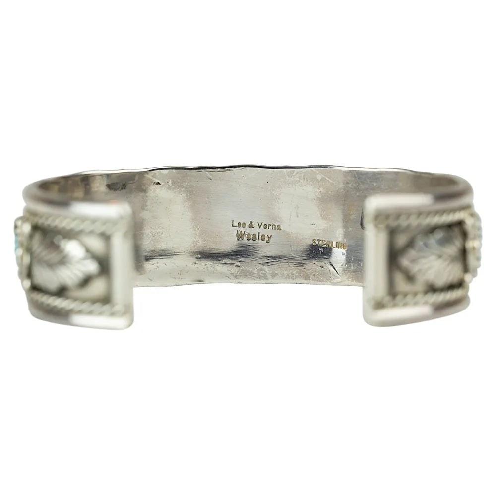 Silver Navajo made bracelet interior with benchmark on a white background