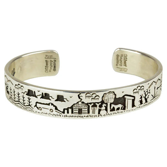 Silver Navajo Storyteller Cuff Bracelet from Gilbert Begay on white background