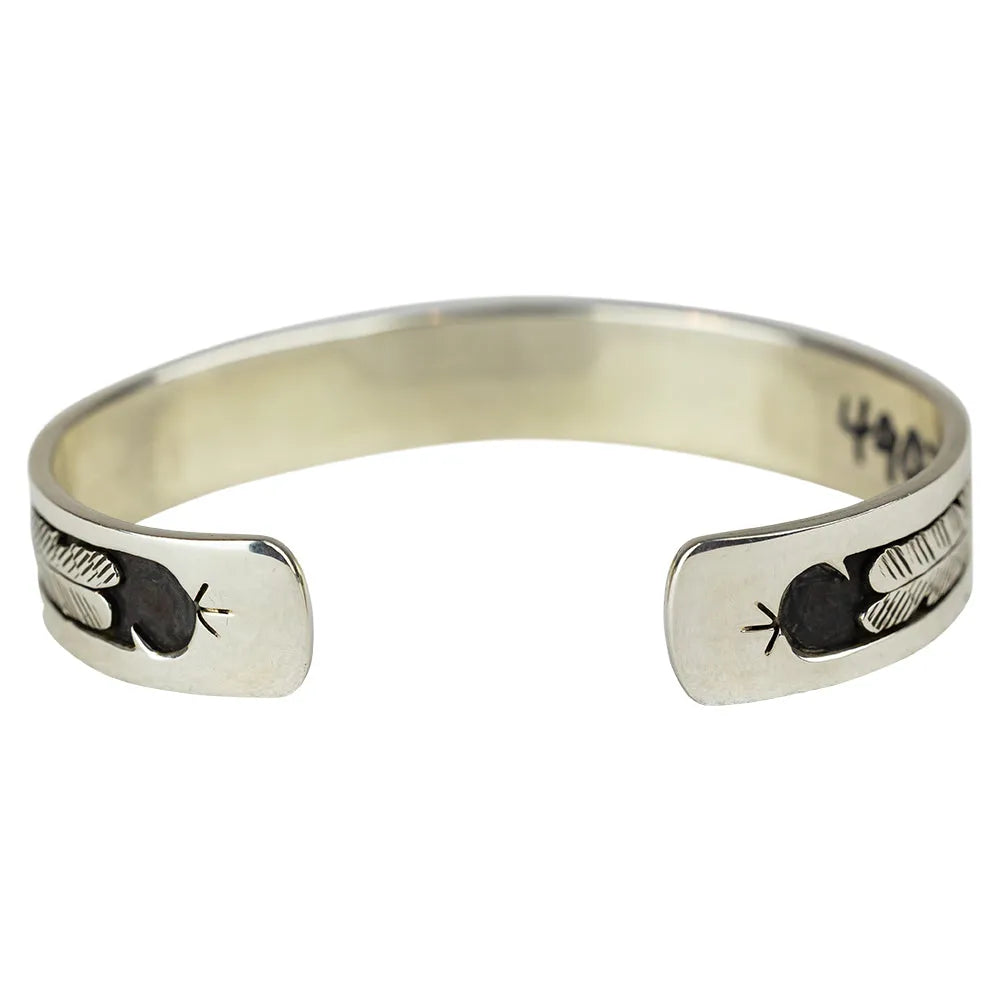 Silver Navajo Storyteller Cuff Bracelet by Gilbert Begay detail and interior on white background