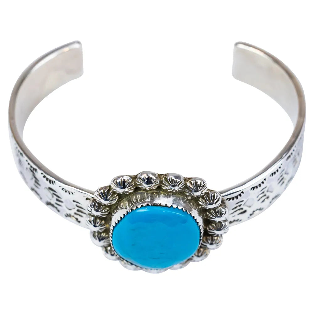 Silver bracelet with a turquoise stone on a white background