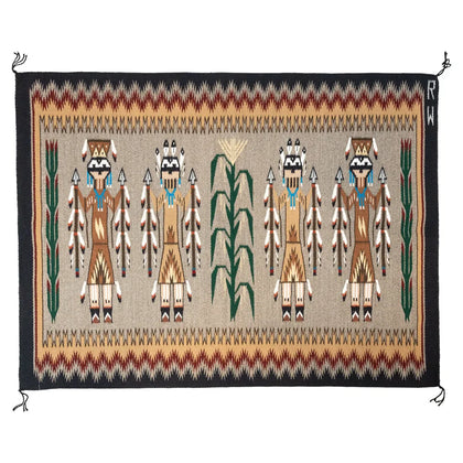 Woven textile rug with Native American figures and corn stalks on a beige background
