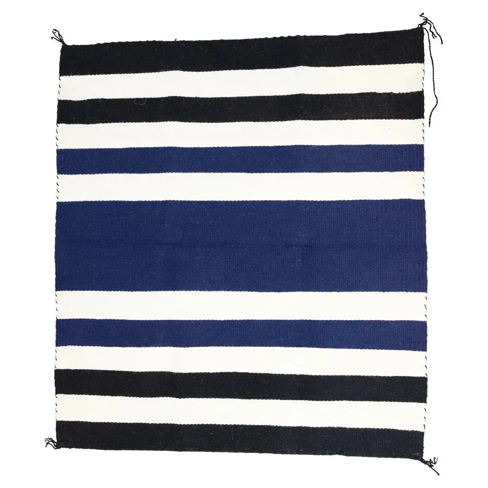 Striped Navajo blanket with black, white, and blue horizontal stripes on a white background