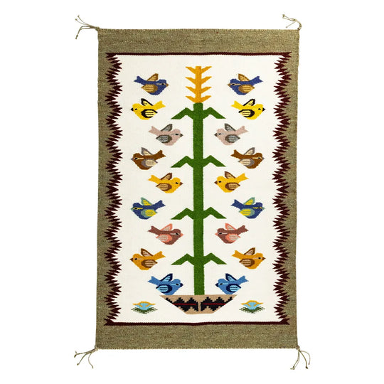 Handcrafter Navajo woven textile with bird and tree design on a white background
