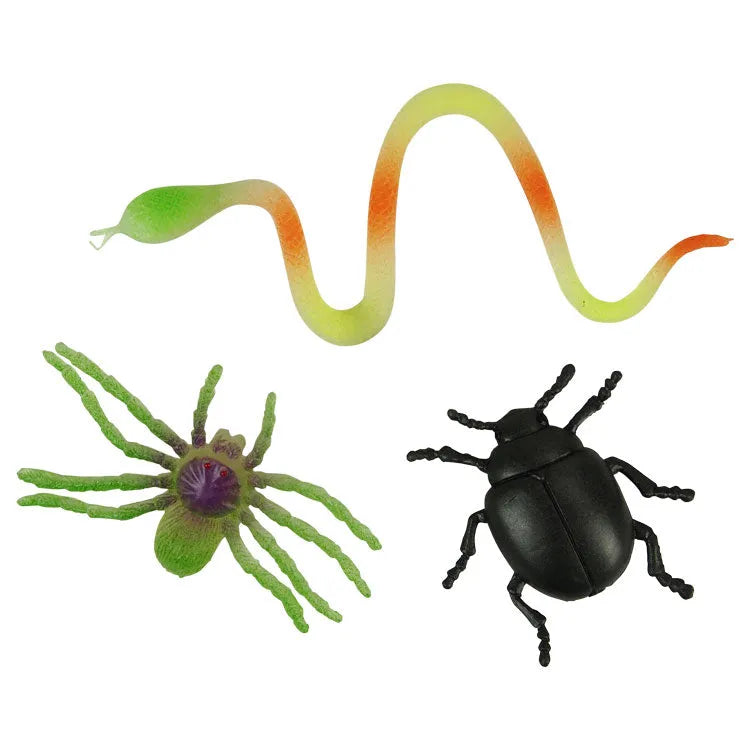 Set of toy insects including a snake, spider, and beetle on a white background