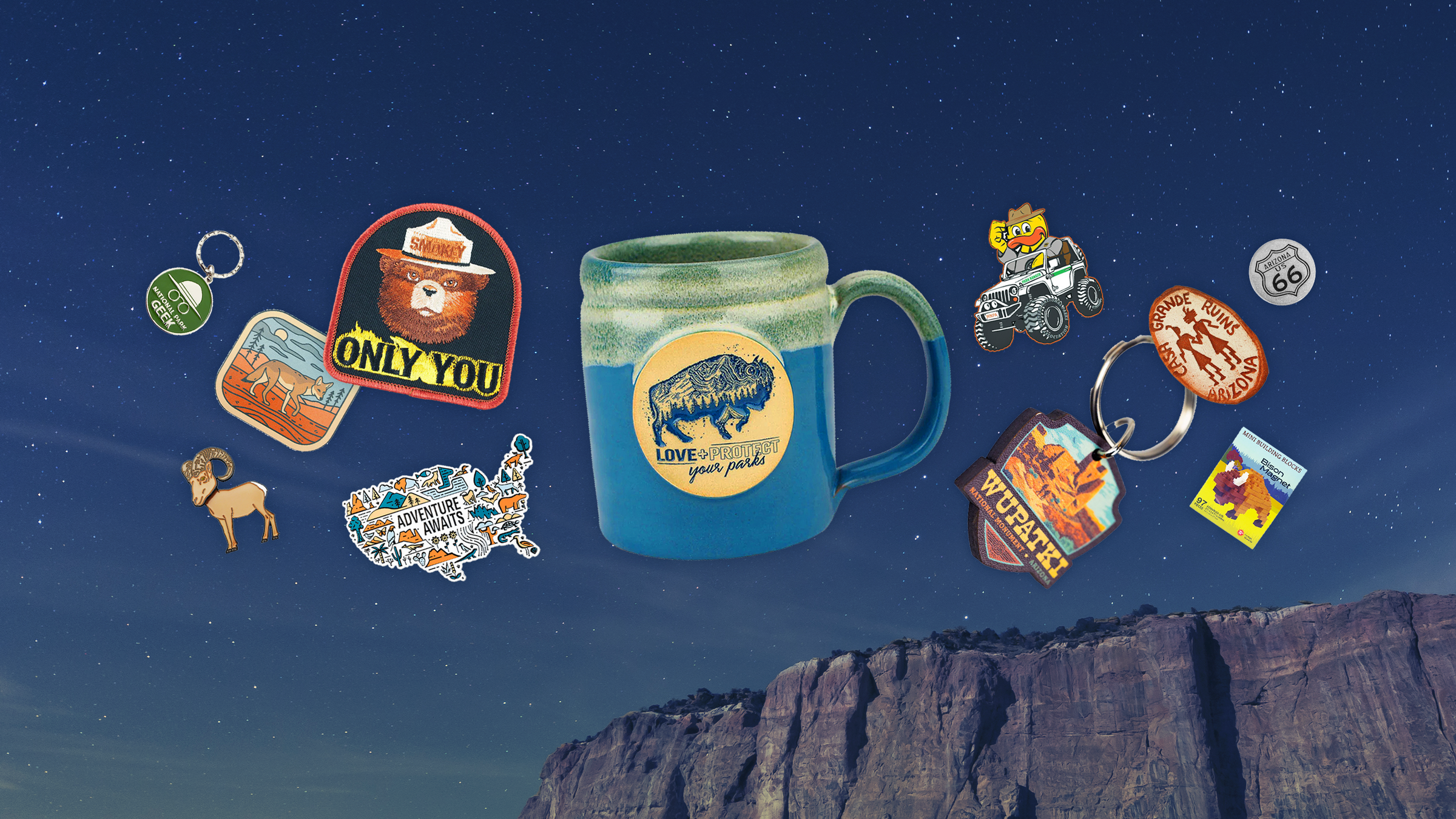 Collection of themed mugs and keychains against a night sky with mountains.