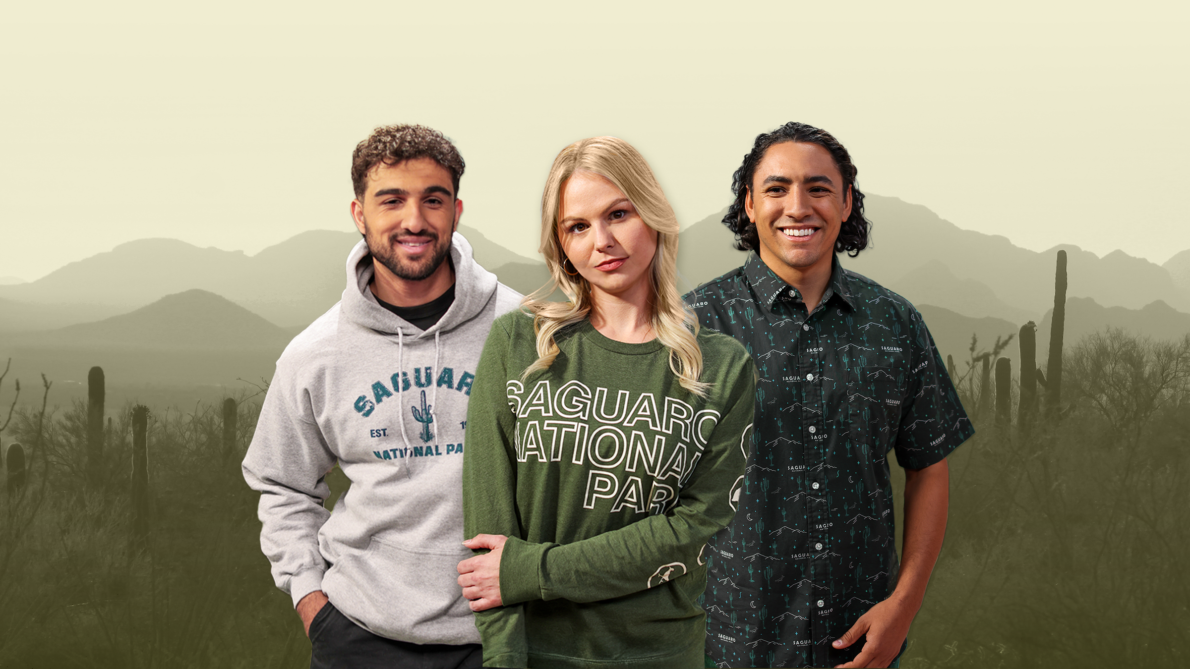 Three people standing together with a desert landscape background featuring cacti and mountains.