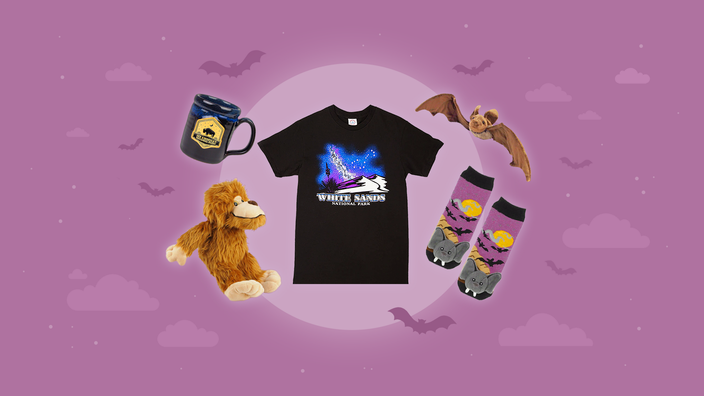 Collection of merchandise including a t-shirt, mug, plush toy, and socks on a purple background with bat illustrations.